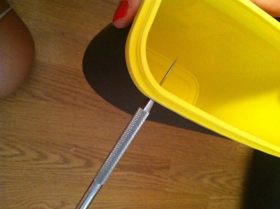 Now you need to make a hole for your brackets. I chose to use a non cranking hole puncher to make the hole.  You can purchase these at any craft store. (: