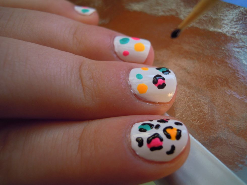 Now you need to round the color dots with black nail polish making "brakets" or a "C" letter shape.