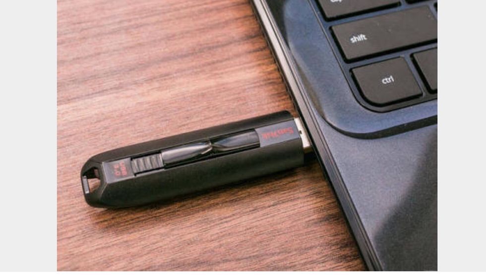 Now you put your USB stick in the computer to put your work in.