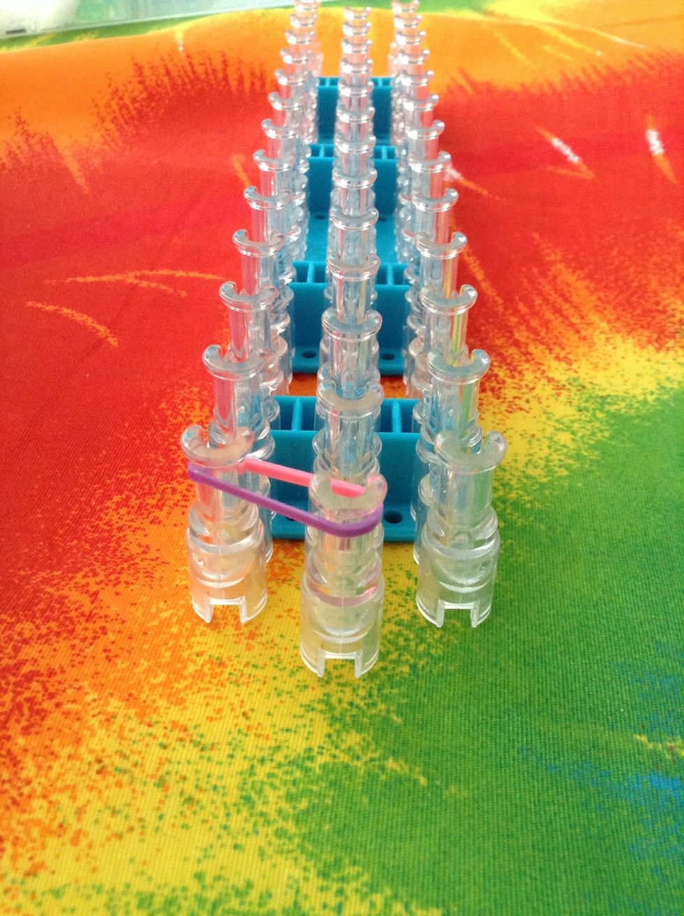 now, you're going to be putting an elastic from the middle row to the row on the left as shown in the photo above.