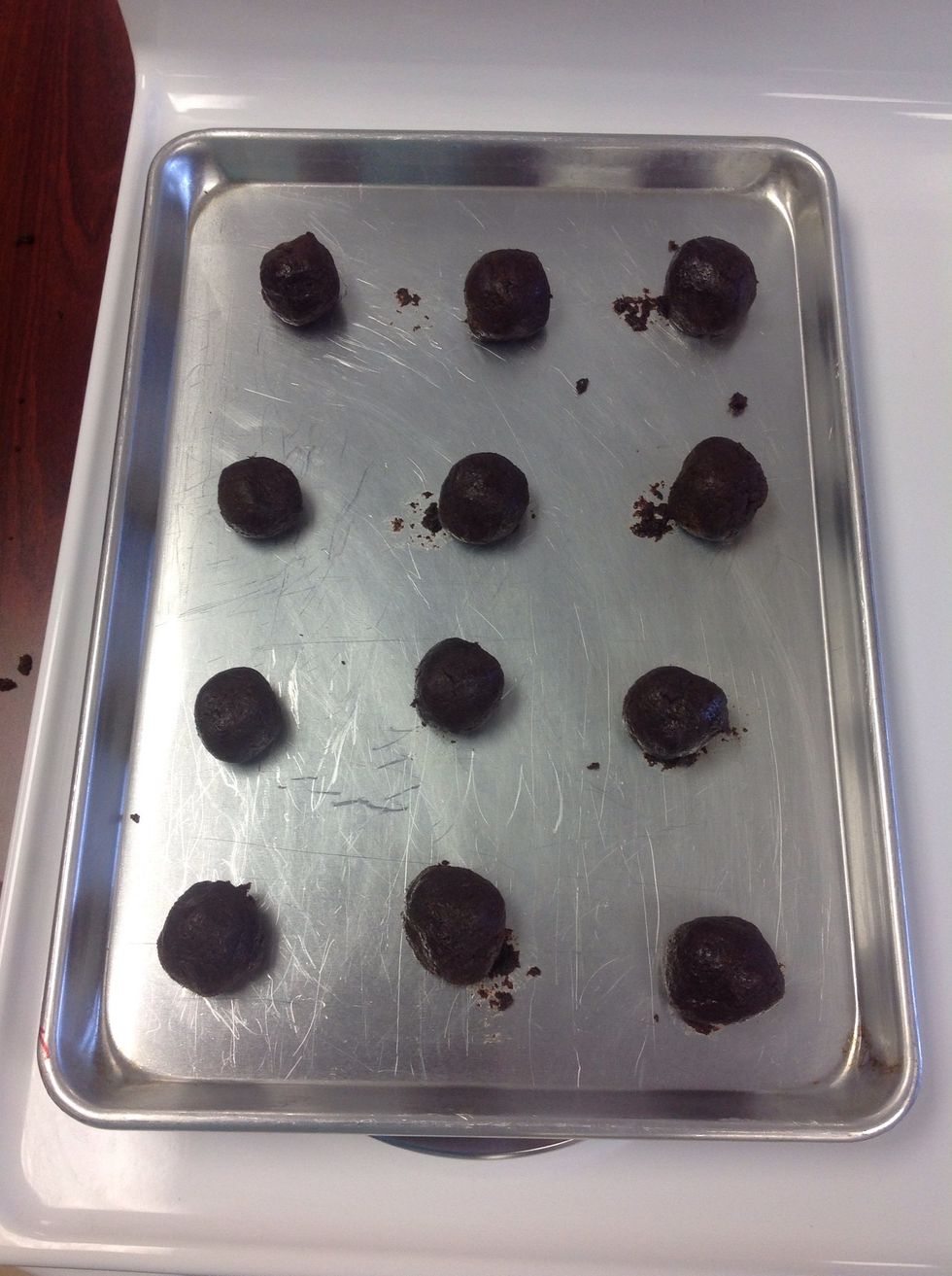 Now you're going to take small pieces of dough, roll them up, and space them evenly on your greased pan