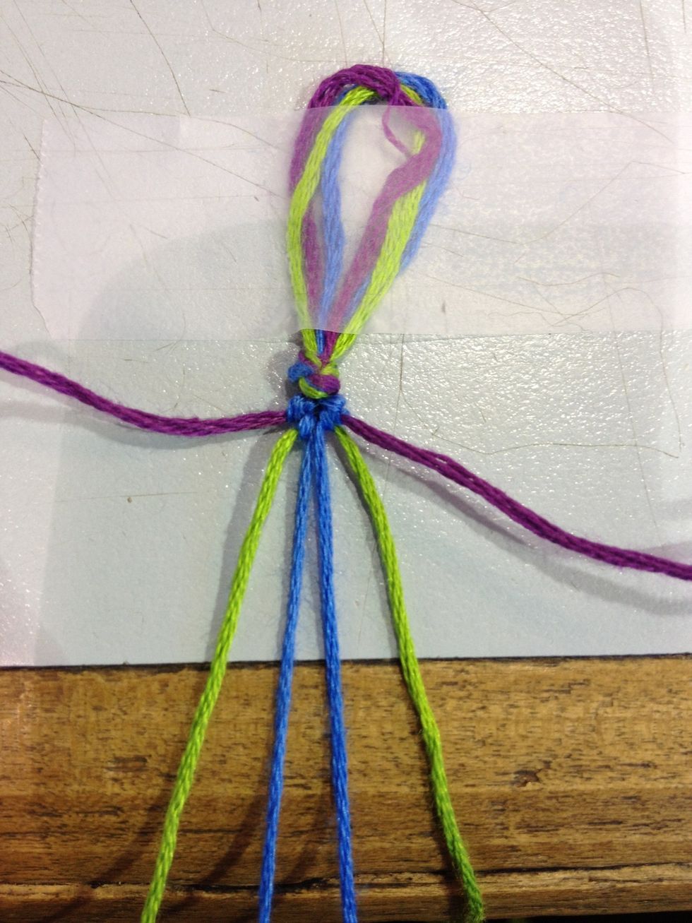 Now you're onto the middle. You take either string and tie the 2 knots but make sure you tie the knots with the same string. I tend to take the right hand side and do the backward 4