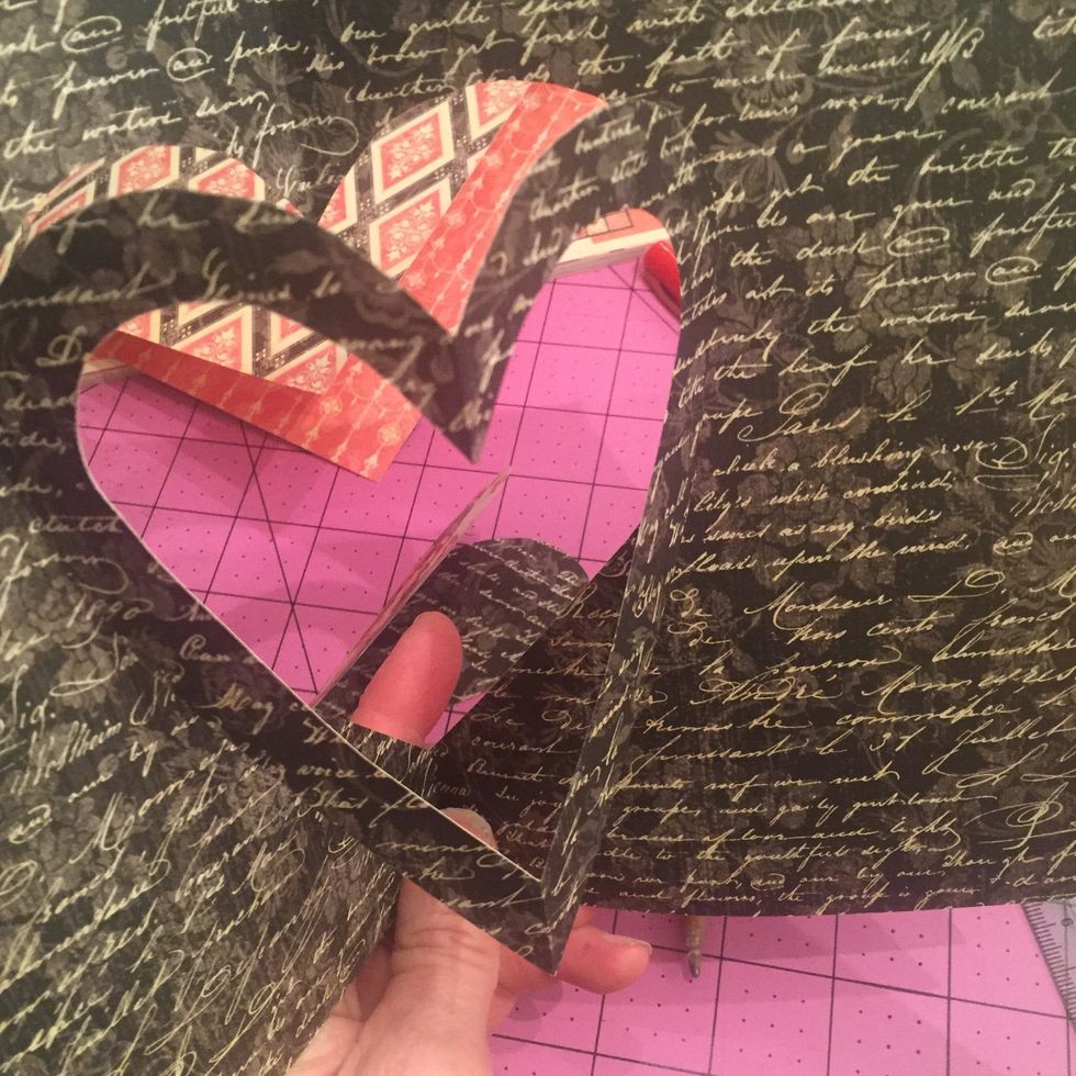 Now you should be looking like this. Gently take your finger and push the inner folds towards you, and then re crease the folds but going outwards