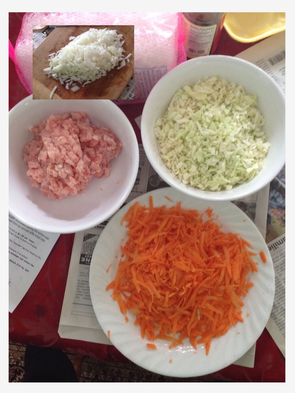 Now, you should have the chopped cabbage, ground pork, onions and grated carrots off to the side.