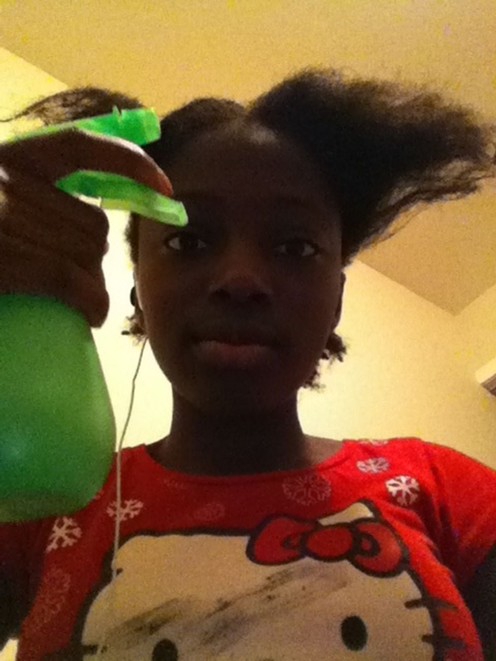 now you take your spray bottle and spray each section until it is damp