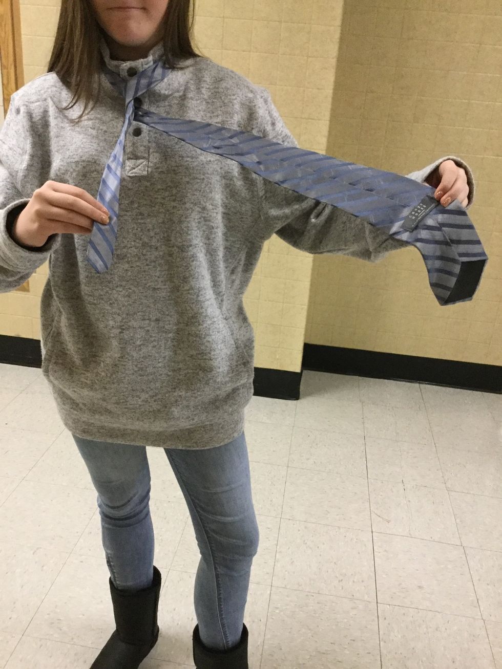 Now you want to bring the fat side around and under the skinny side. The fat should be back on the left and should have made a complete loop.