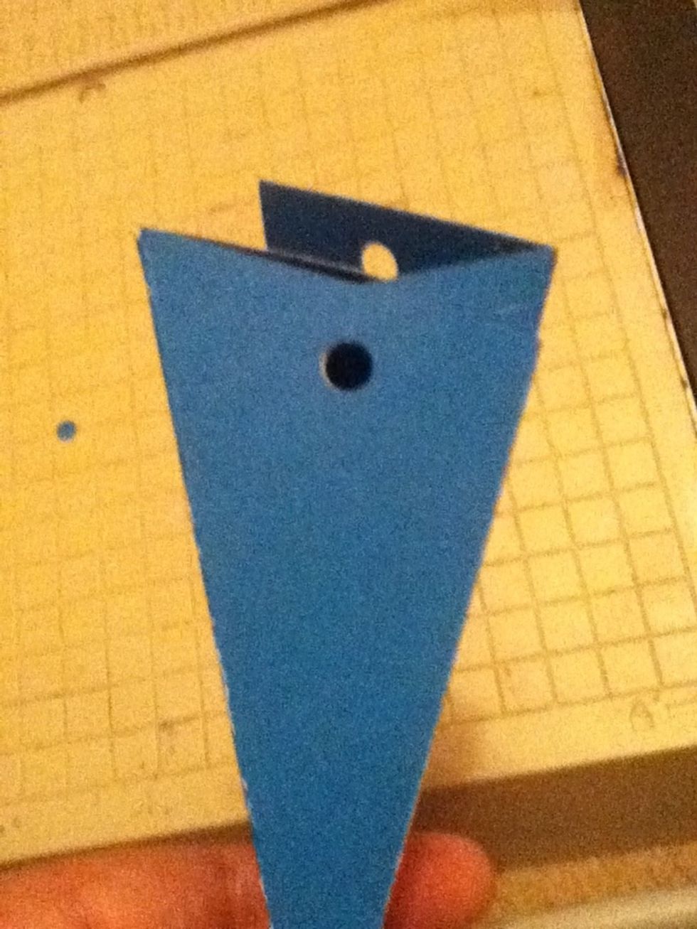 Now you want to poke holes at the top like this on both sides
