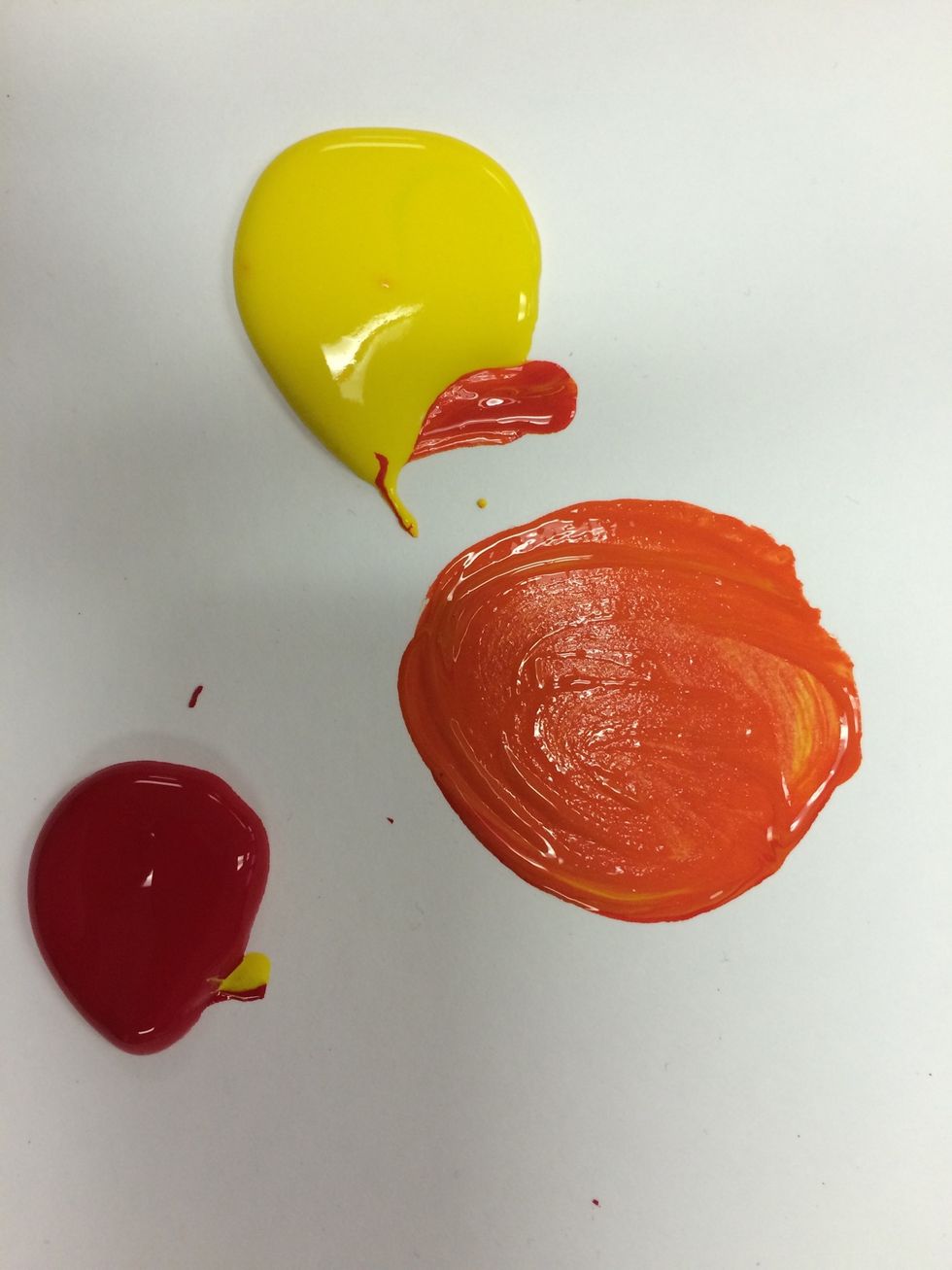 Now you will make the first secondary color: ORANGE. Drag a small amount of yellow over and then add an even smaller amount of red to it. Paint the ORANGE section with this color.