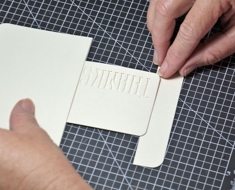 Now you will need the square tag bottoms that were trimmed off. Attach to the bottom of the word tag as shown. Be sure to line it up with the top piece of the tag.