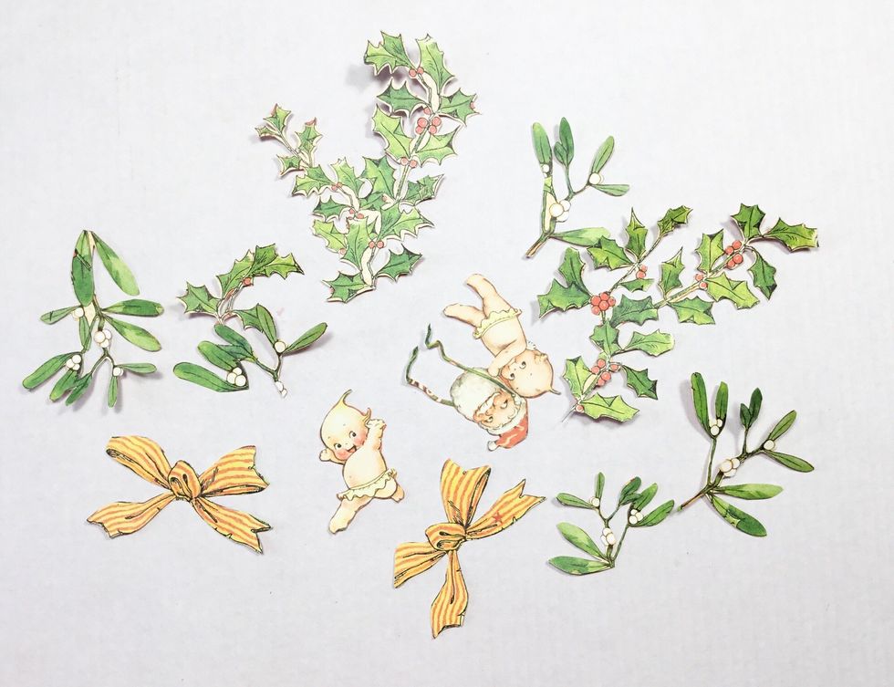 Now you will need to get fussy cutting. You can cut more or less, it depends on how many tags you wish to create. These have been cut from Happy Holly Days and Countdown Surprise patterned papers.