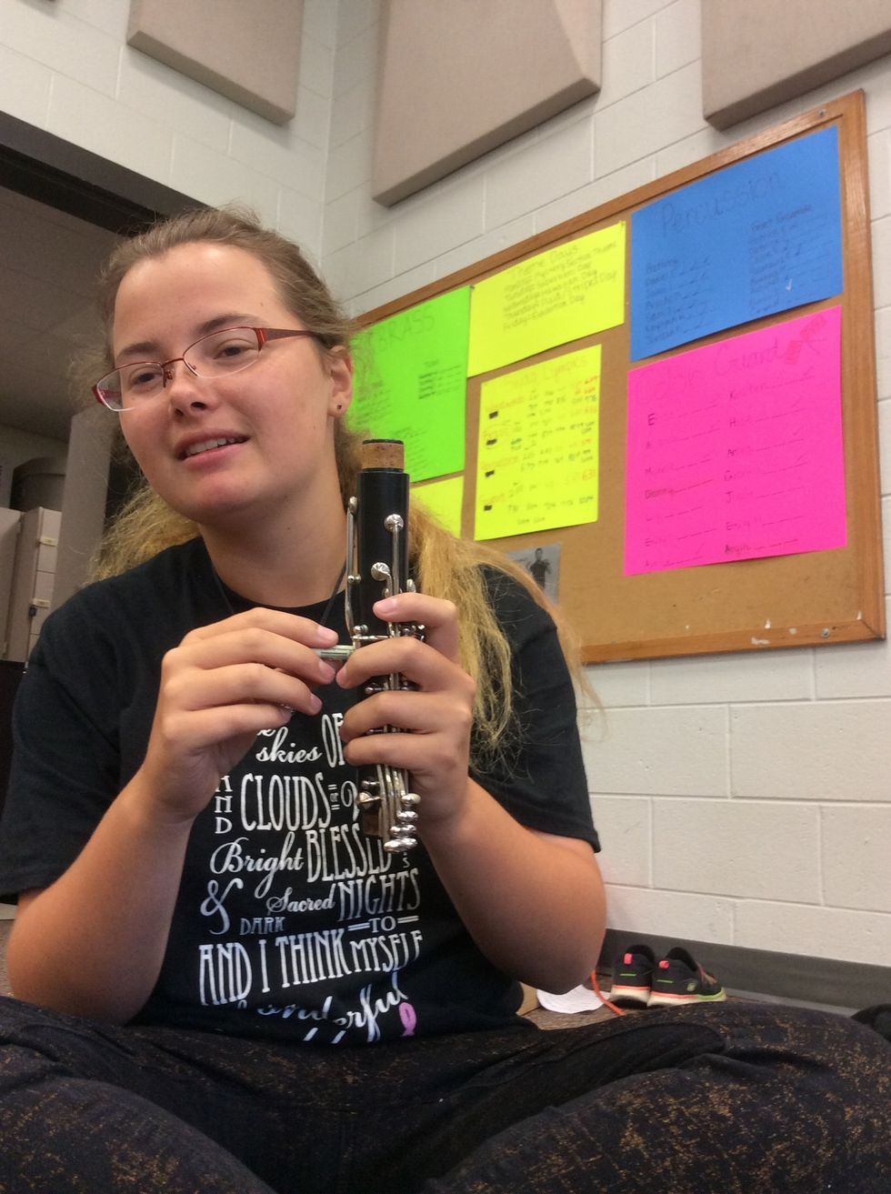 Now you will twist the rolled dollar bill inside so you may clean the hole.