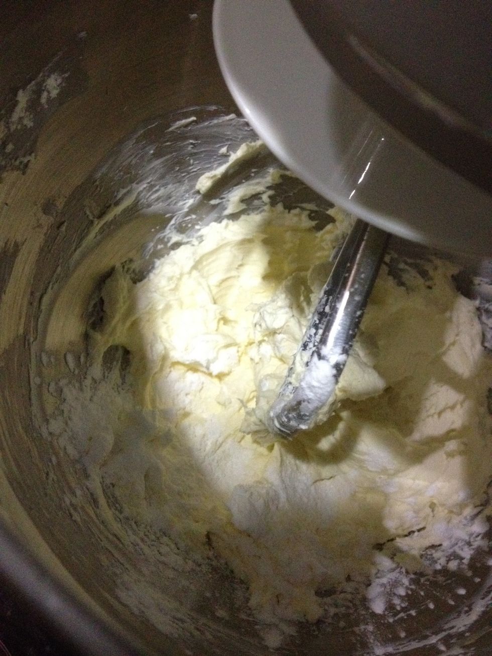 Now, your cream cheese should be pretty creamy. Add corn flour to it and mix it.