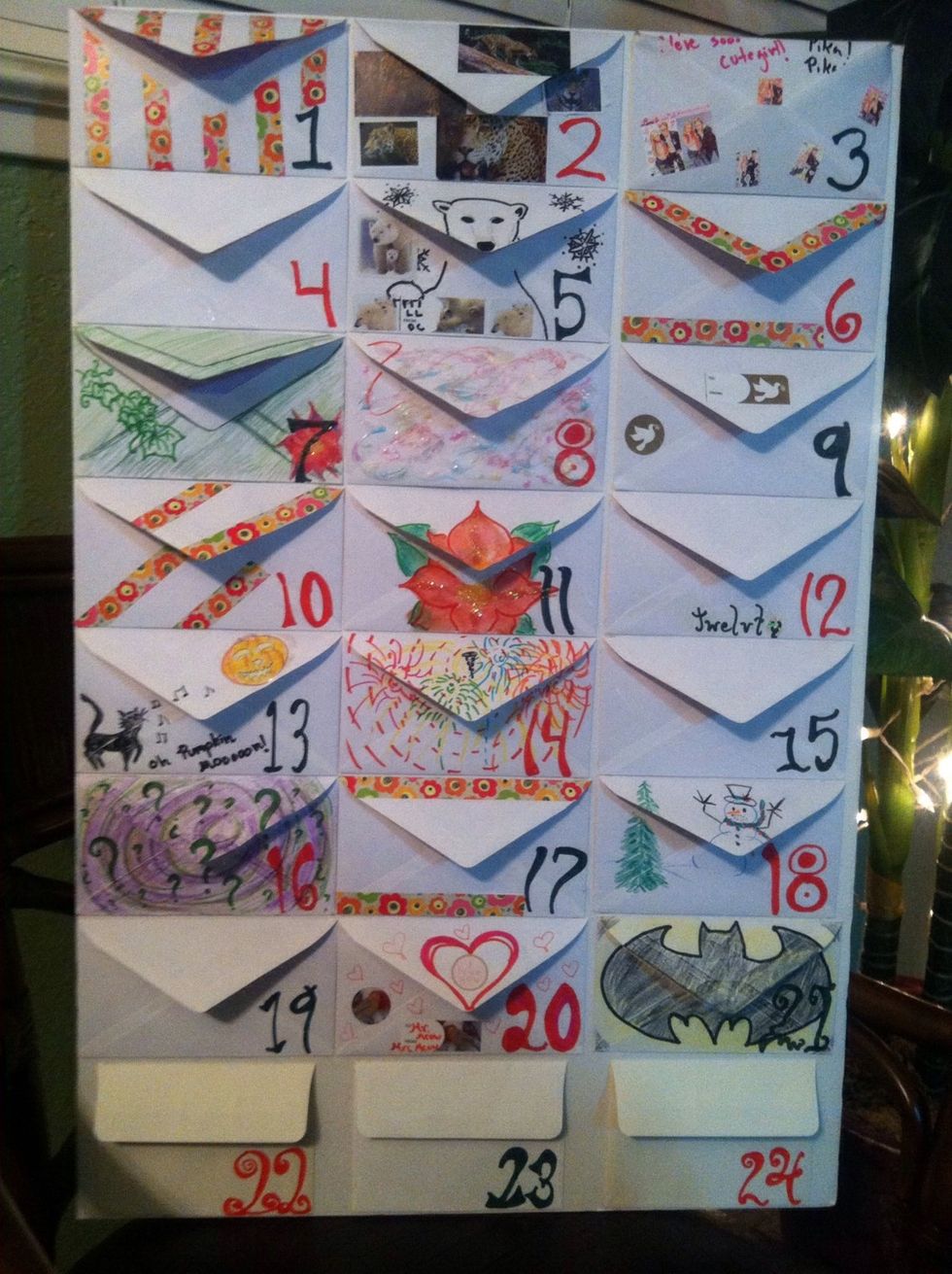 Number each envelope and if you want, create a special design on each one.  I combined Christmas designs with drawings special to the person I made this for, like Mickey, Batman, and inside jokes.
