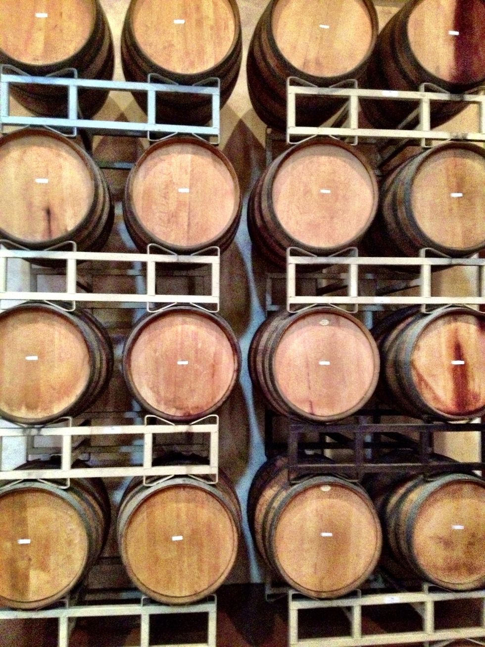 Oak barrels line stone walls as Jacuzzi wines age to perfection!