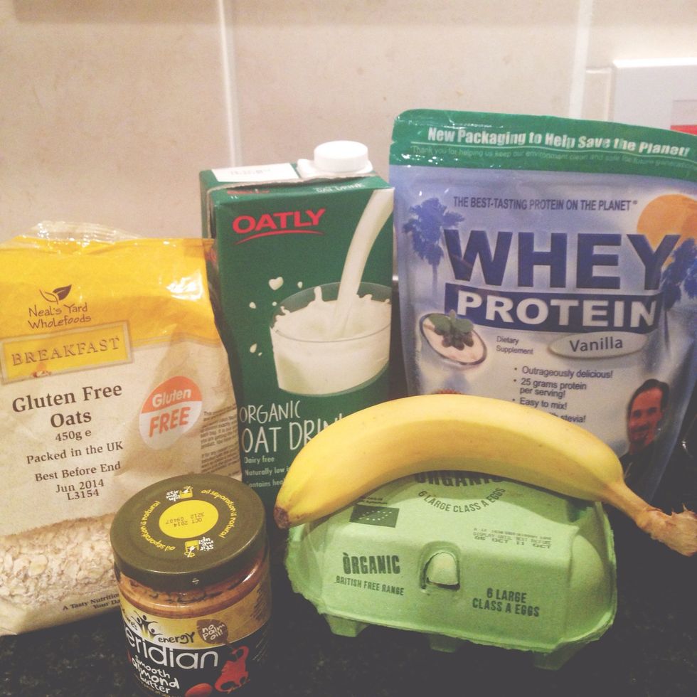 Oats, oat milk, banana, egg, vanilla whey (I use Jay Robb), fry light, cinnamon, almond butter