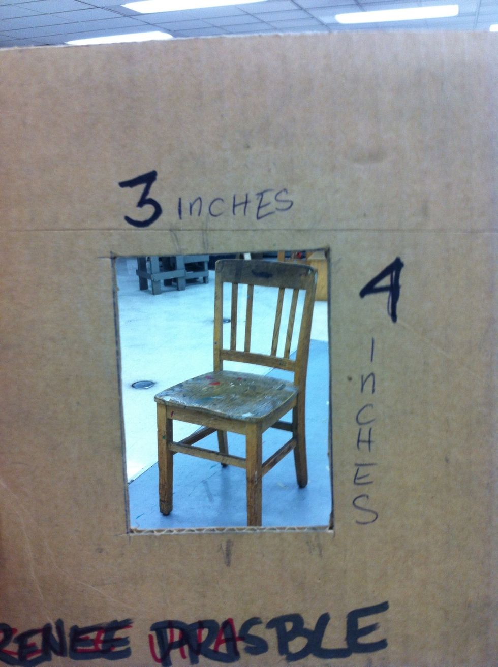 Observe the chair through your view finder. Zoom in and out until the chair touches 2 or more sides of the view finder.