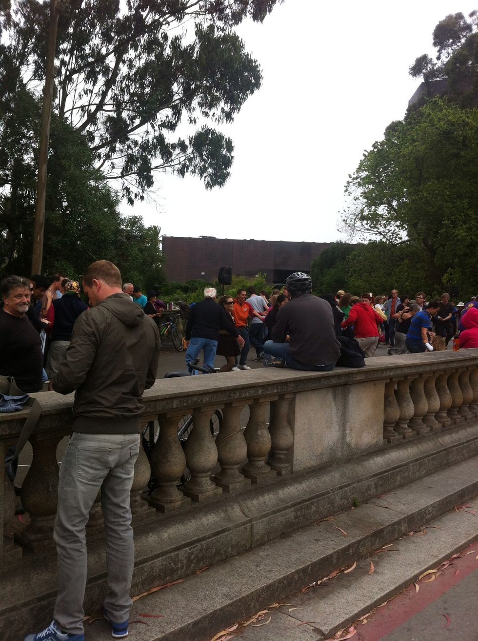 Observe the group dancing lesson being given for free.