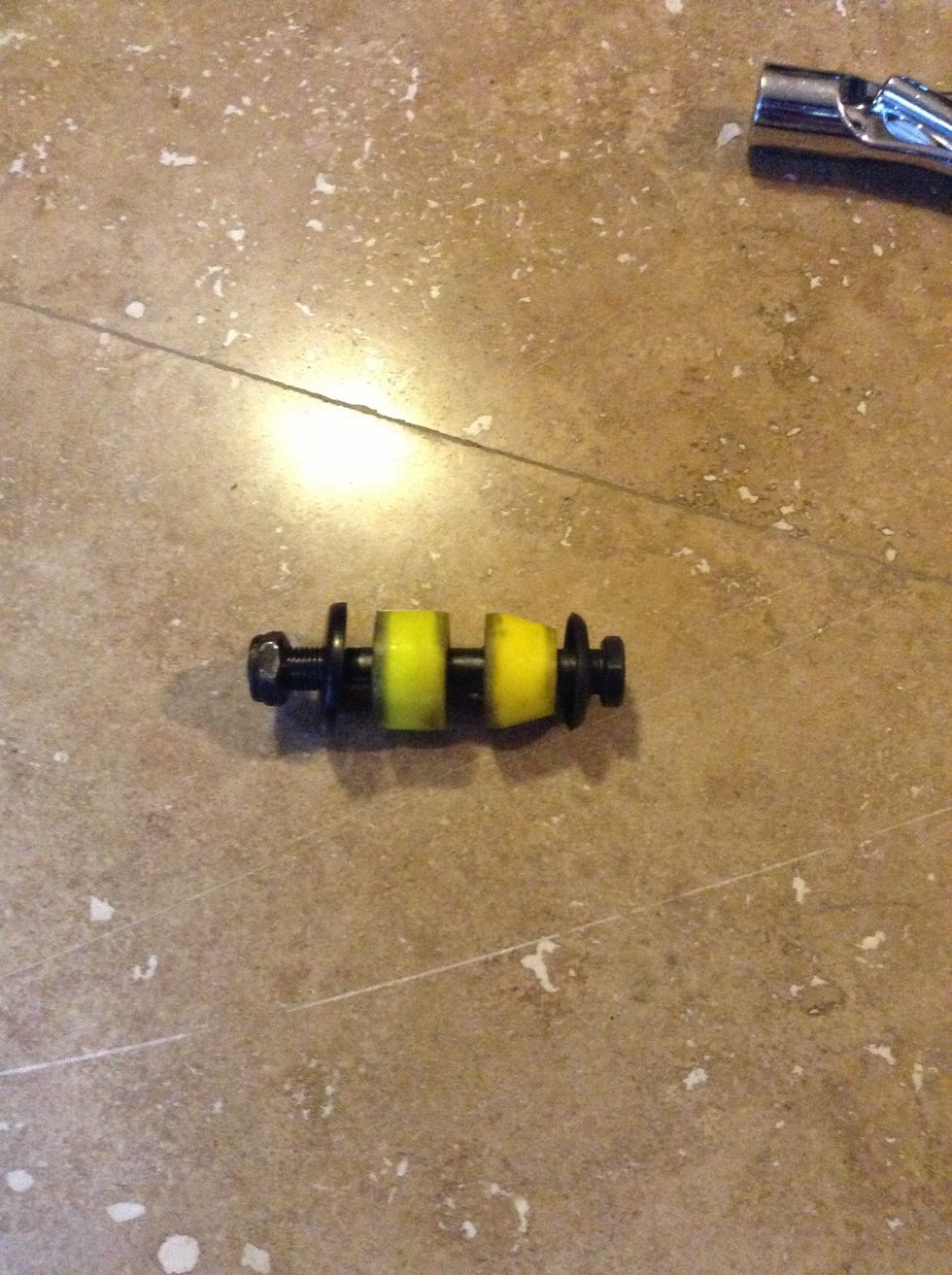 Observe the order in which the bushings and washers are placed along the kingpin. Left to right: Kingpin nut, large washer, barrel bushing, (hanger goes between bushings), cone bushing, small washer.