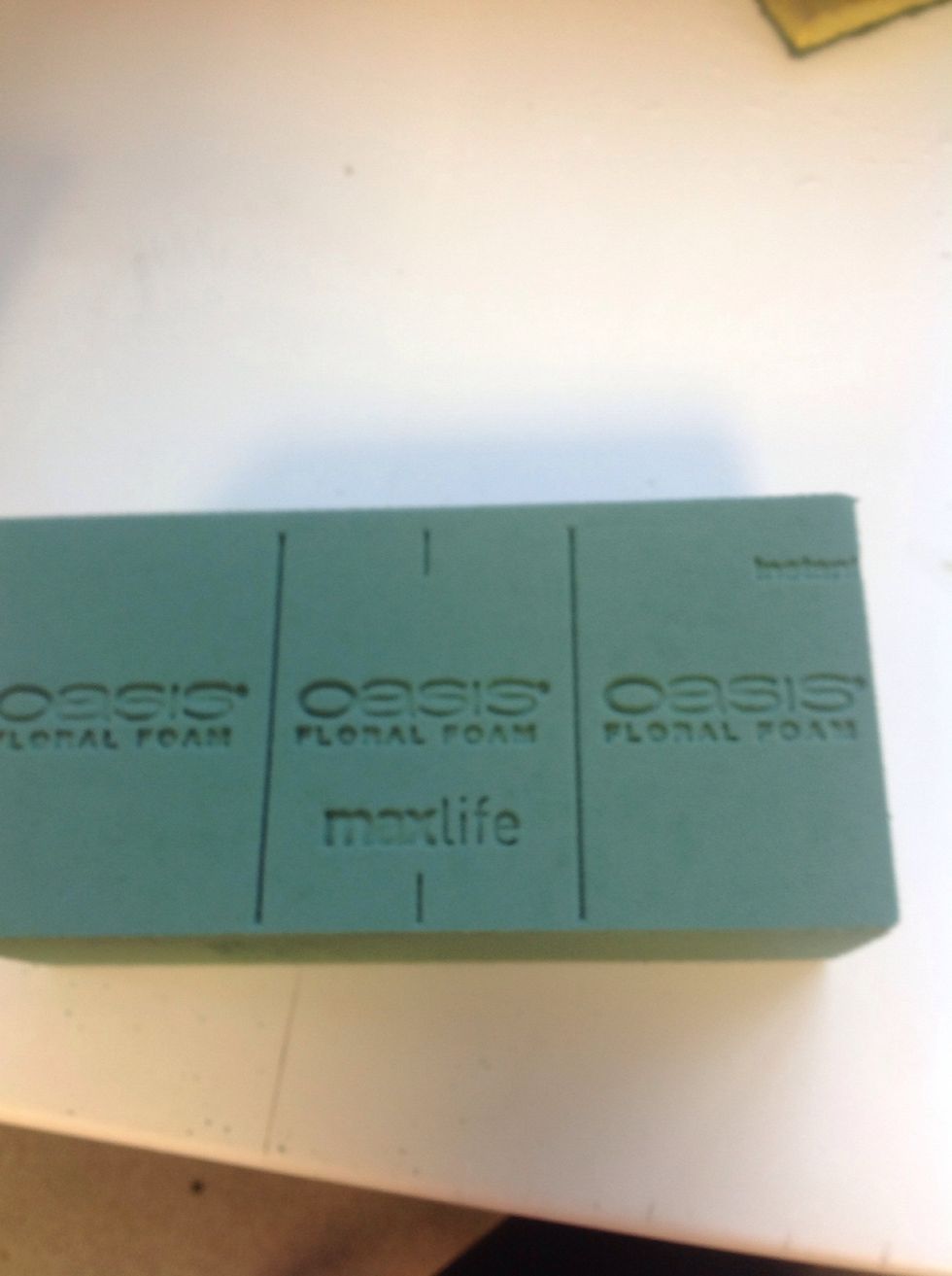Obtain a block of floral foam that has 3 individual blocks ready to cut.