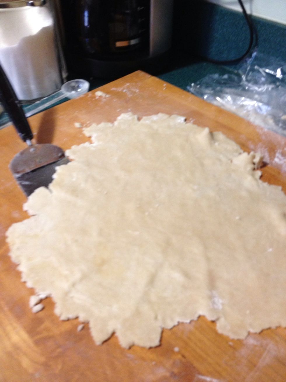 Occasionally, you don't put quite enough flour on the board and your dough is stuck to it. When this happens get a metal spatula and slowly separate the dough from the board.