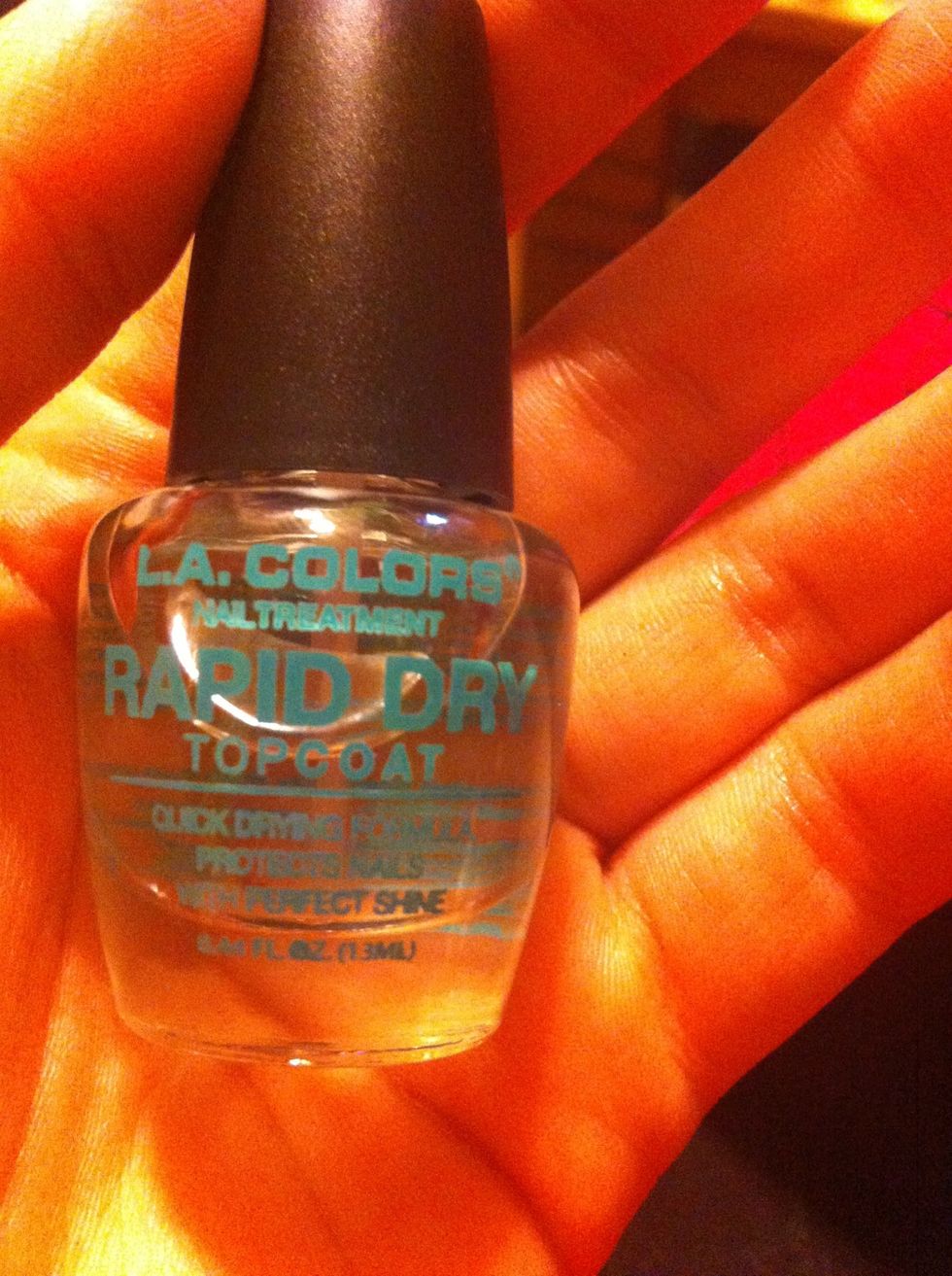 Of course, the last step is your top coat. Then, use the acetone and a q-tip or small paintbrush to clean up around your nails.