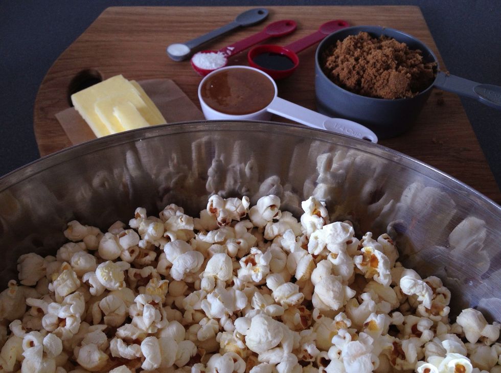 Oh, and don't forget the popcorn! Air popped is better. Pan or microwave popped works diddly do too. Just make sure it's plain. Thank you muchly moo. Divide popcorn between two bowls and set aside.