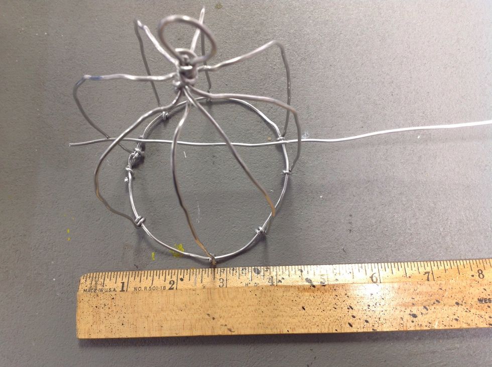 Oh no! The bird can get out the bottom! Cut 3 more wires that are a little longer than the diameter of the circle.