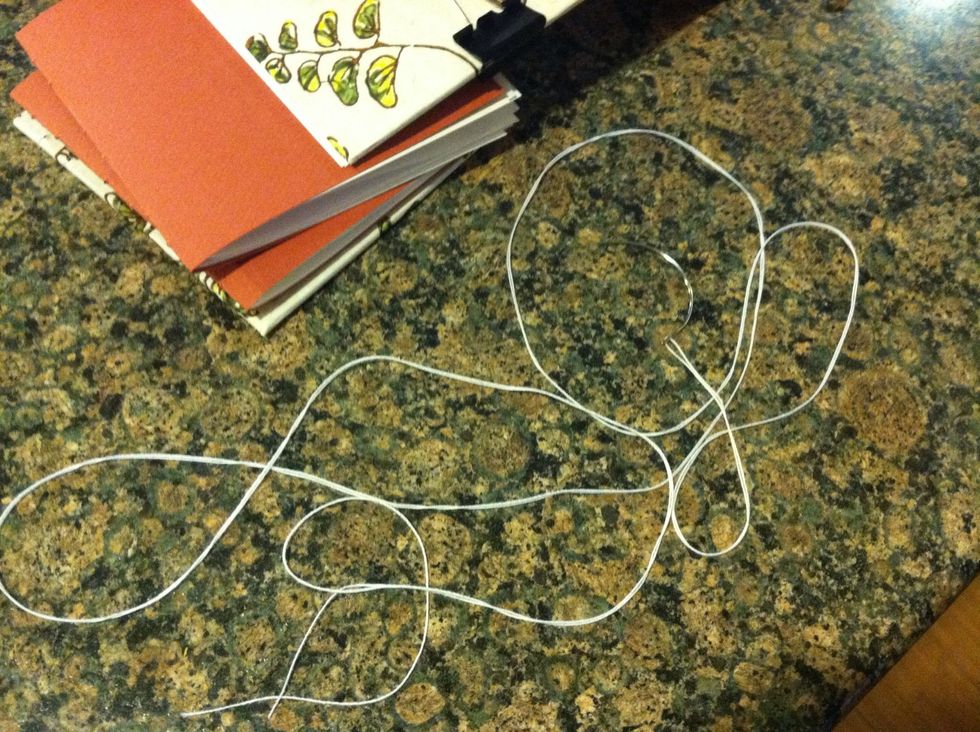 Oh the thread! Choose a color! take 2 arms lengths, thread the needle, move to the middle of the thread.