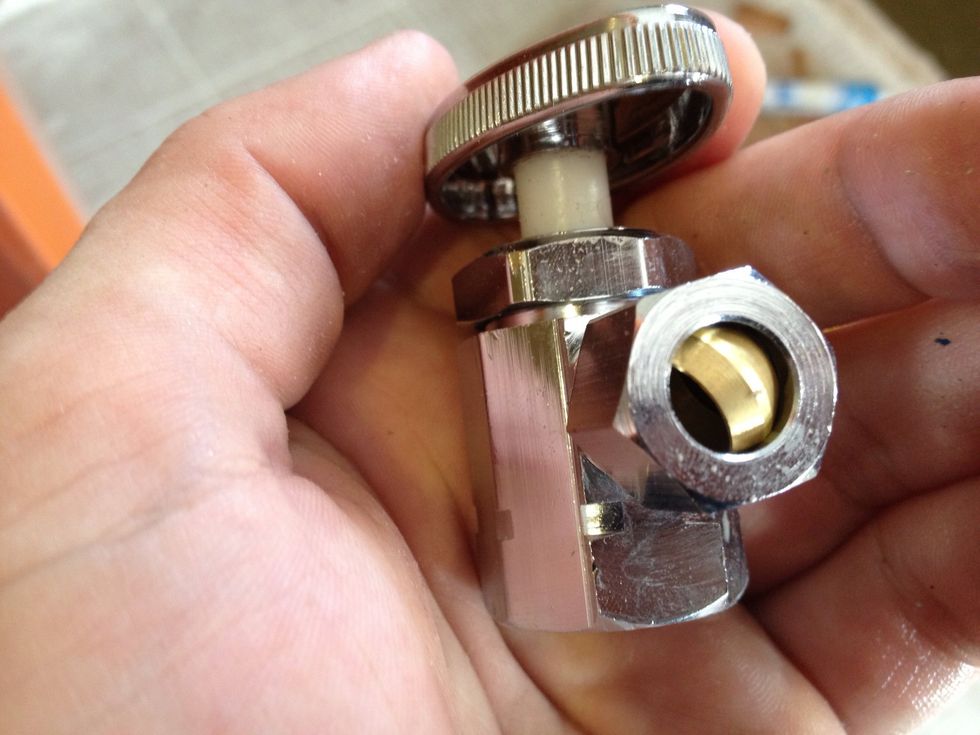 Ok, as promised, here's a bit more info on the housing. See that weird brass looking piece under the metal collar in the picture?