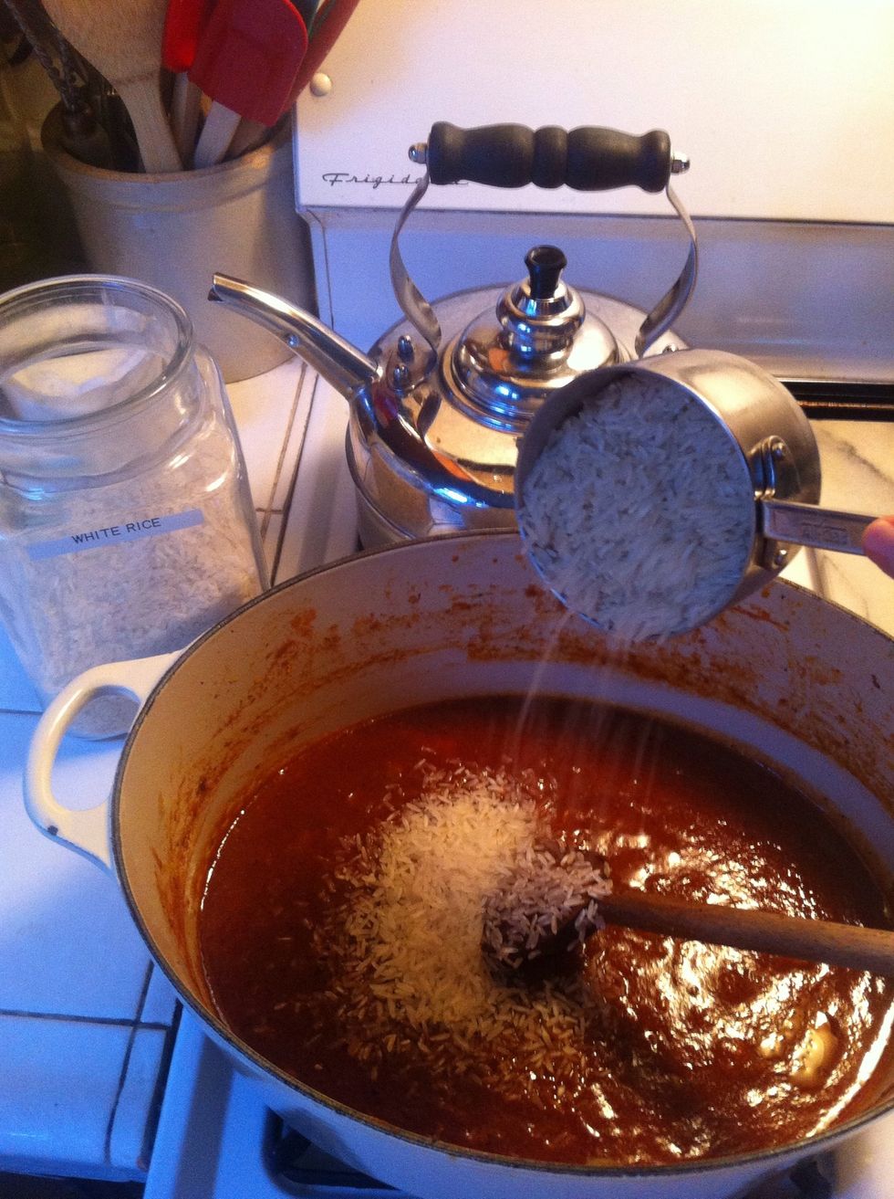 ok back in the dutch oven add the rice and water. bring up to a boil then drop the heat to low and cover. you know like making rice normally.