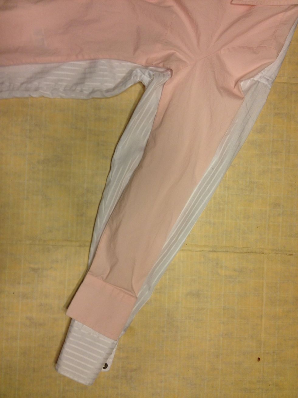 Ok. First turn both shirts inside out. Flatten & smooth out the sleeves. Making sure the seams are both at the "bottom."