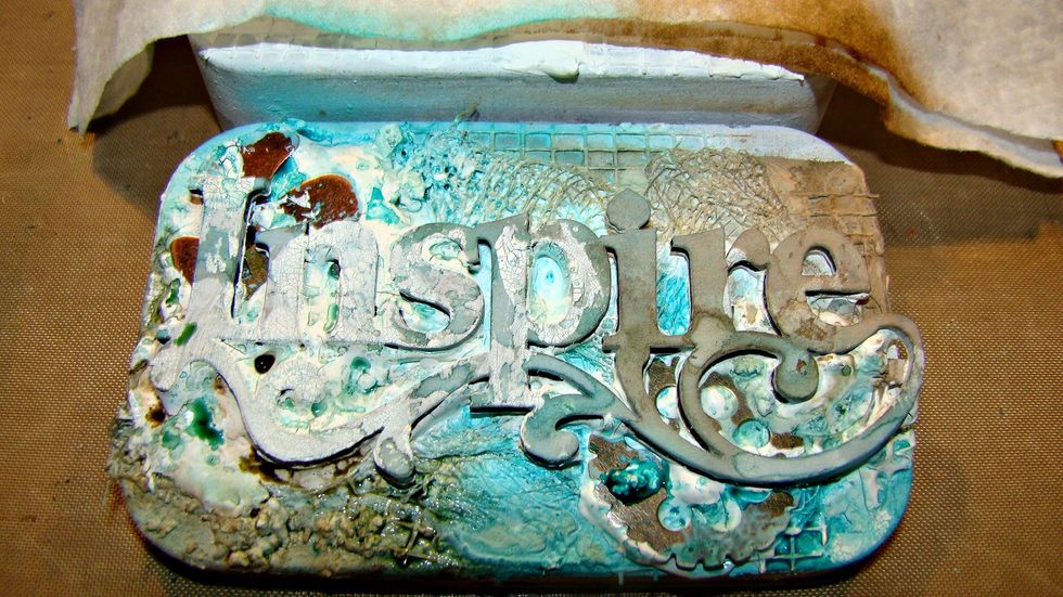 Ok, let's get started with coloring the outside of the tins. I started with my Coloration Sprays in Siesta Key and Warm spraying randomly and drying in between coats.