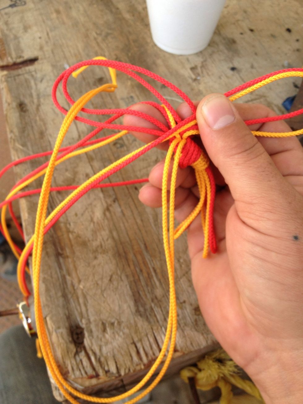 Ok... Now (important) take the limp line and place it through the loop. The one you see in the photo goes through the front and the one in the back goes through the back. Don't let this deter you