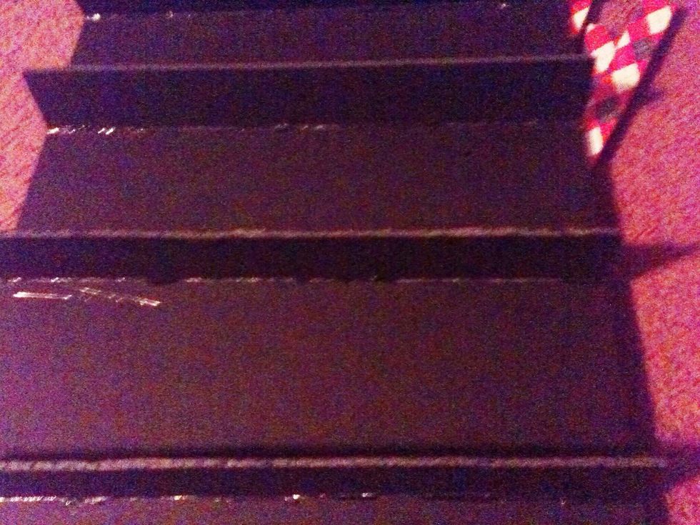 Ok, now take your shelves and hot glue them on the lines you drew on your first board earlier. I recommend putting the glue in the shelf then sticking it in the whole board.