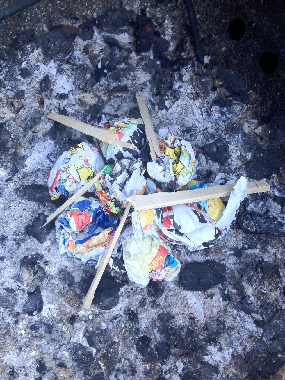 Ok once you have your news paper balls start by placing small pieces of the wood on