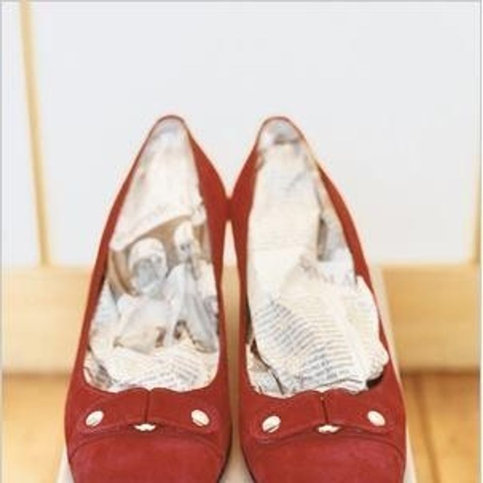 Ok, quick! Shake the shoes of excess water and stuff with newspaper.