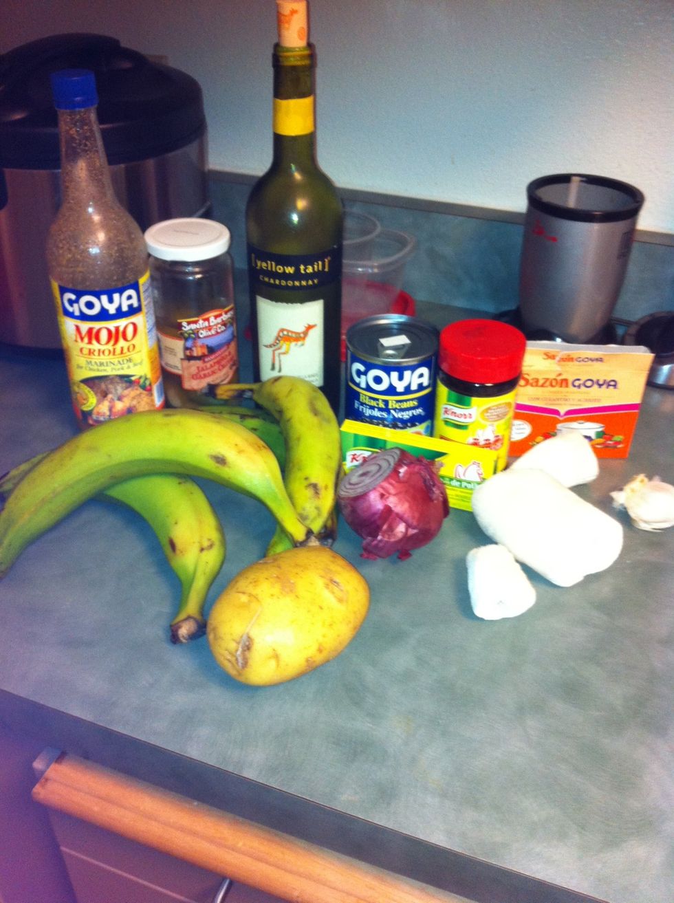 Ok so you need 2 yuccas 1 small red onion 2 cloves of garlic. (plantains /tostones)white wine , oregano, chicken thighs, Sazon with achote , bullion chicken cubes, green olives, (Goya mojo is extra)
