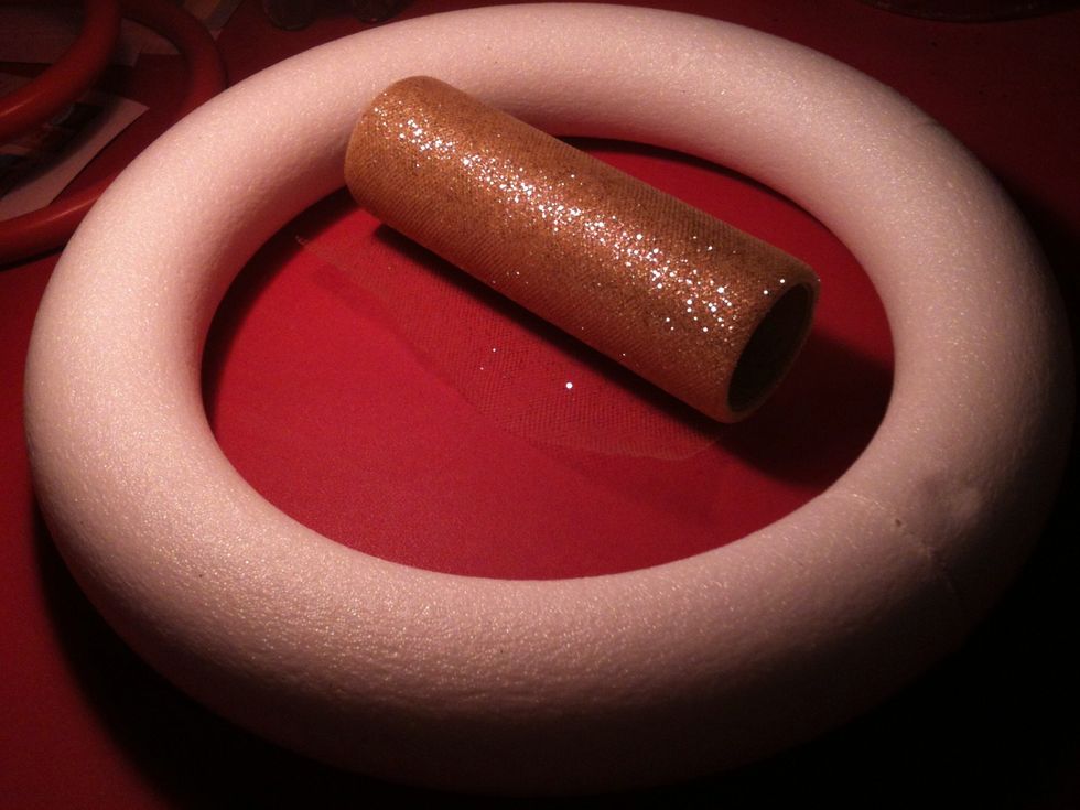 Ok take your styrofoam ring and ribbon. Ok, It's not exactly ribbon but you get the idea.