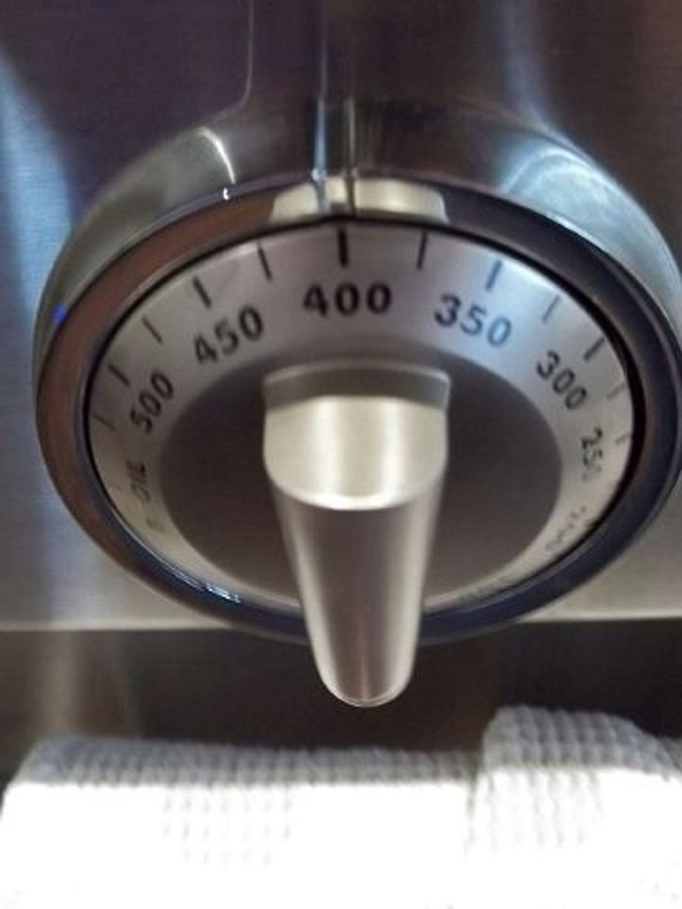 Okay I'm going to bake my bacon this way it won't splatter everywhere and make a big mess. So preheat your oven to 400.