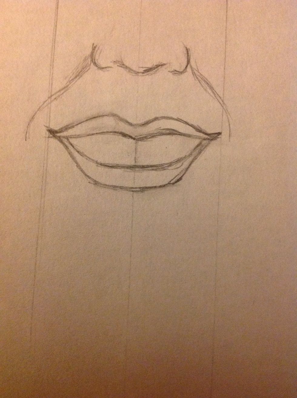 Okay, now the difficult part: the teeth. Draw a line in the middle of the smile, this is going to be our reference.