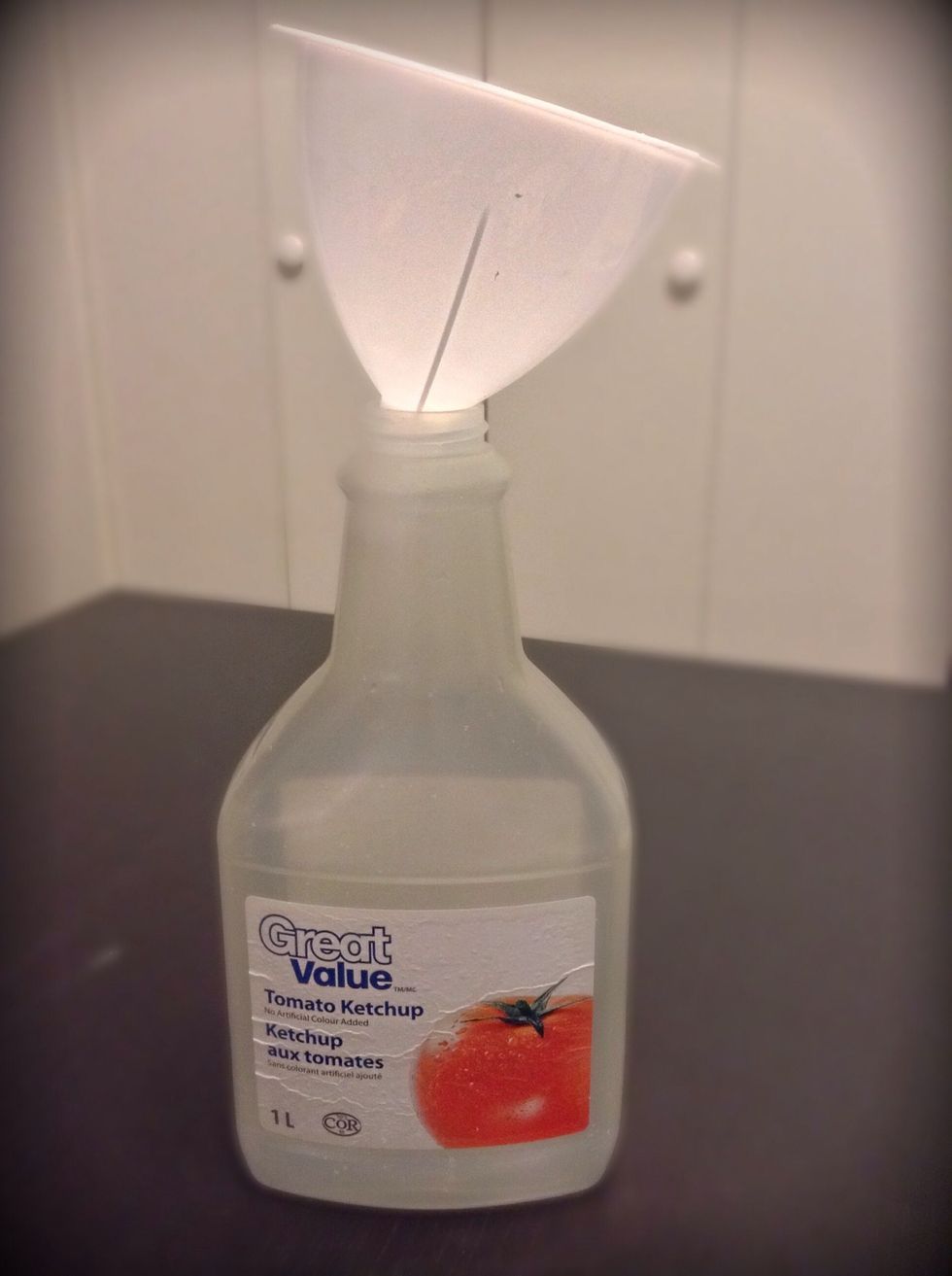 Okay, now this is my little tip to you. Find an old ketchup bottle and use a funnel to pour the batter into the CLEANED OUT ketchup bottle. I find this works great for squeezing out the batter.