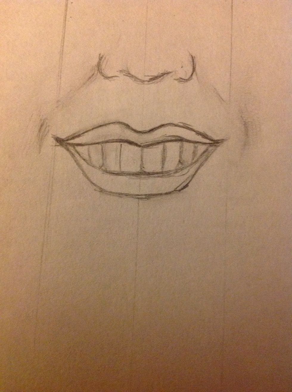 Okay now we are going to banish that ugly lines, erase softly both ones. With the pencil, softly, mark the lines near the mouth and then blur them with your finger.