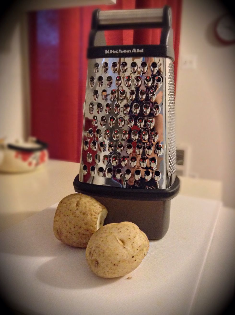 Okay, so now that you know WHY they need to be refrigerated lets move onto the next step. Grab your grater and on the largest hole begin to grate all of your potatoes.