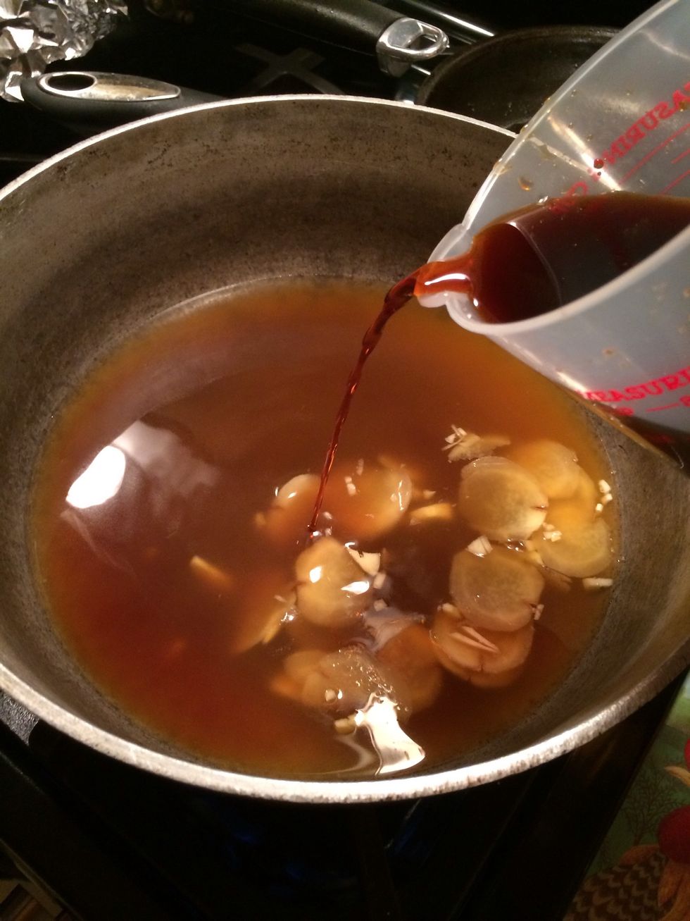Okay the broth has simmered a bit now let's continue on by adding the teriyaki sauce