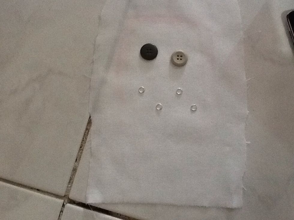 Okie , take what ever you can find to build your monster >.< , .. Usually two different size buttons as eyes look great