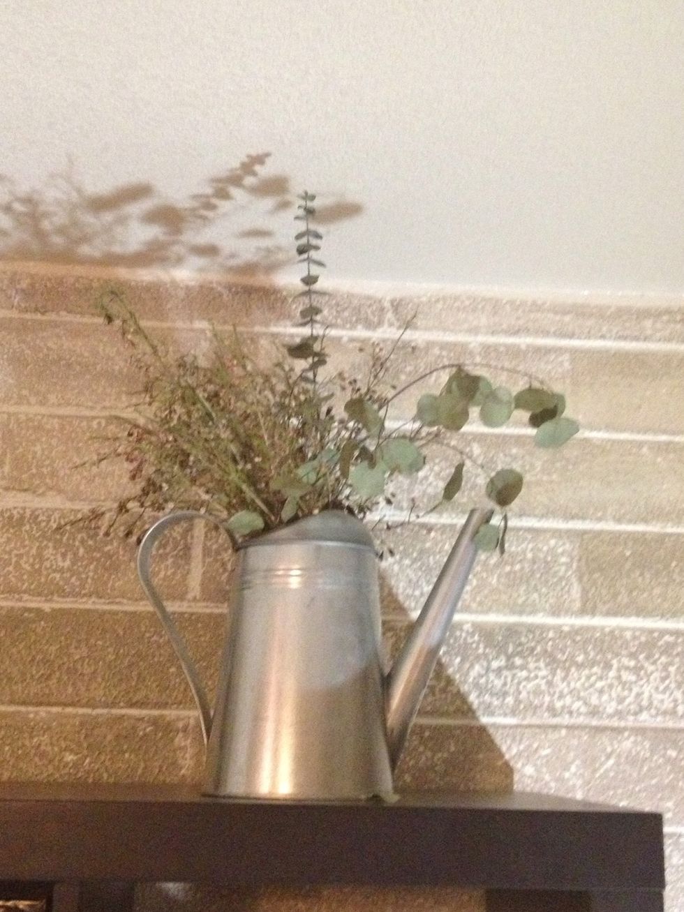 Old watering can got jealous of always giving and running around for the flowers- if they want water they can come to him. Typical !