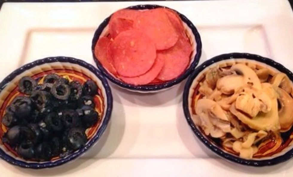 Olives, turkey pepperoni, mushroom stems and pieces...