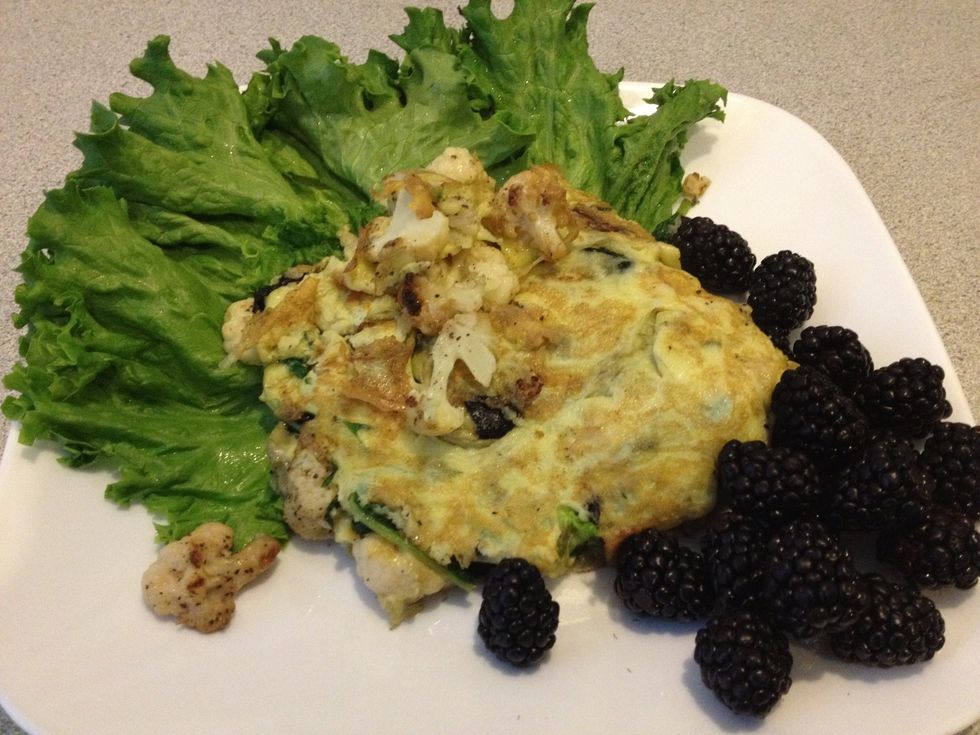 Omlette on the lettuce. Berries on the side!. Voila! Your healthy start for the day is ready. Psst... Try this. Take a medium slice of that Omlette and wrap the lettuce around it - Crunchy wrap! yum