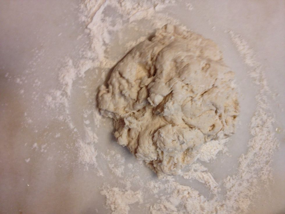 On a flour counter top, knead the dough for about 10 minutes until it's smooth and elastic.