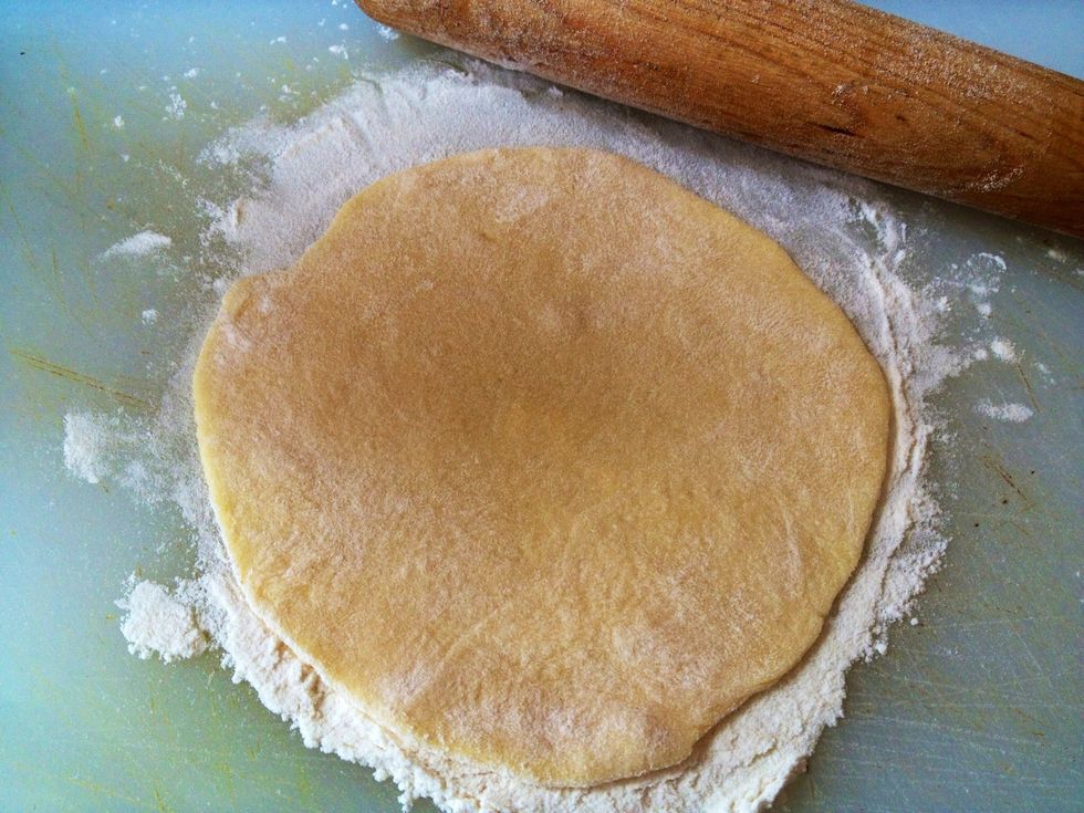 On a floured surface, roll out dough piece to about 3 inches.